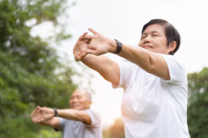 Elderly People Stretching Hands Arms Before Exercise Park Happy Asian Senior Couple Enjoying Workout Outdoor Morning 40048 211 300x200