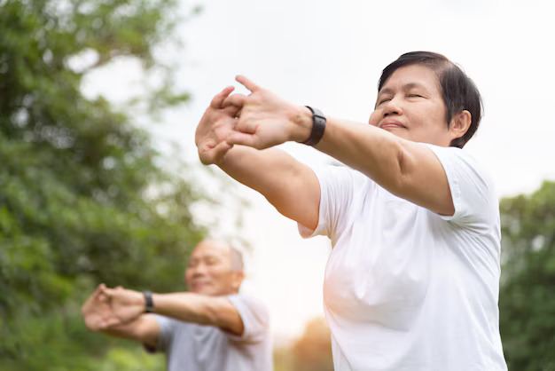 5 việc nên làm ngay khi thức dậy để ổn định đường huyết Elderly People Stretching Hands Arms Before Exercise Park Happy Asian Senior Couple Enjoying Workout Outdoor Morning 40048 211